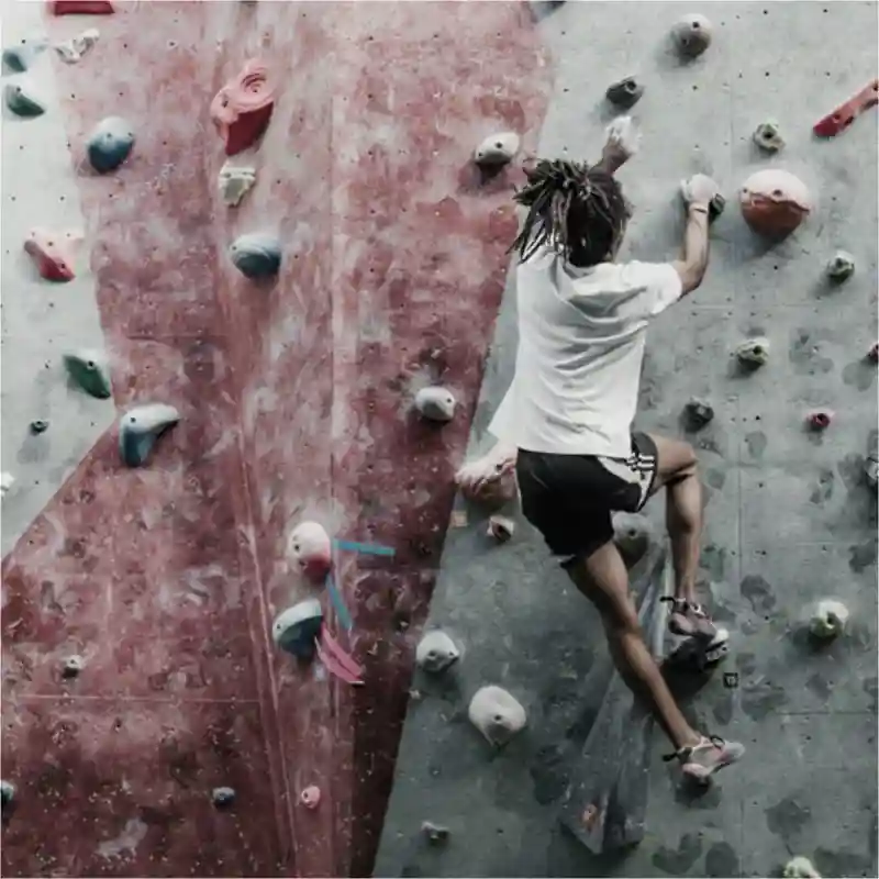 Rock climber on am indoor climbing wall.