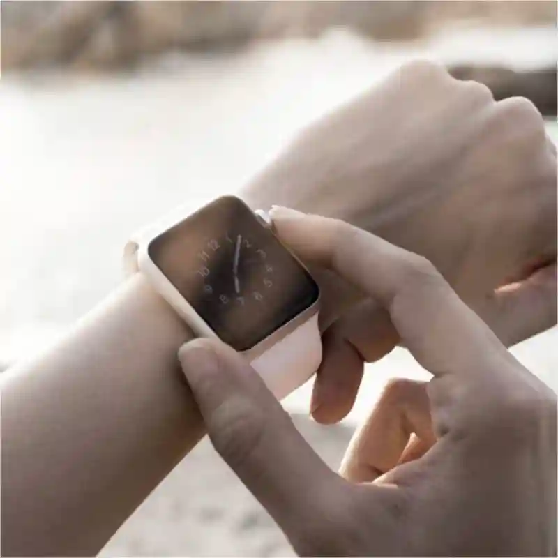 Hand touching a smart watch