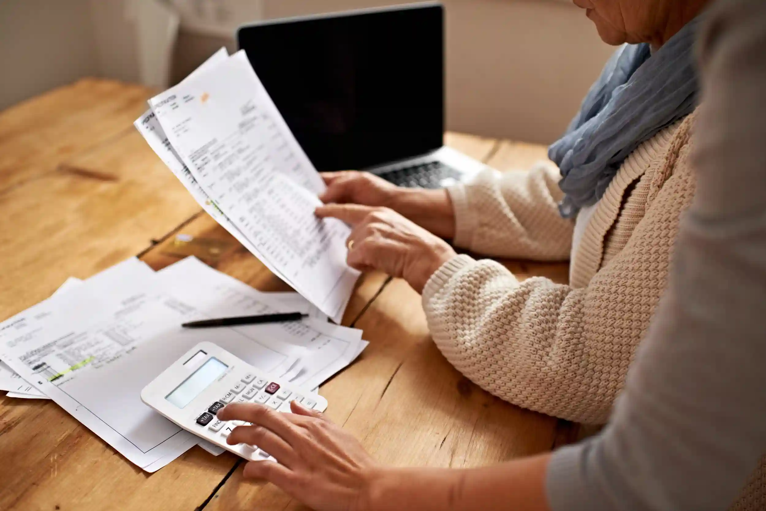 A woman calculating her taxes.