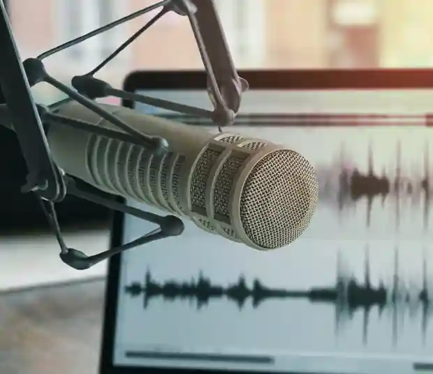 podcast microphone and laptop